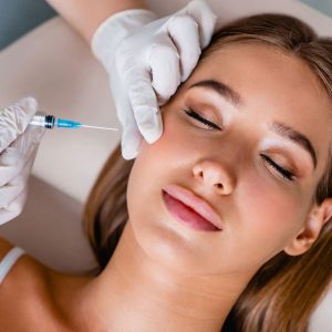 Lady laying down having Anti Wrinkle Injections